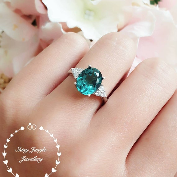 Custom made blue Sapphire and Brazilian Paraiba Tourmaline Engagement Ring  for lovely Alyson. 🌟Story: Alyson loves anything that has to… | Instagram