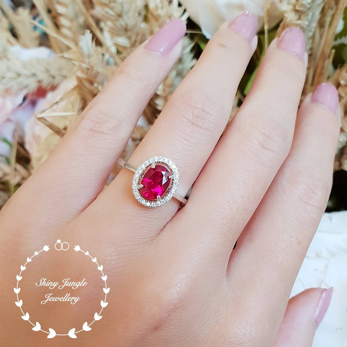 oval ruby halo ring