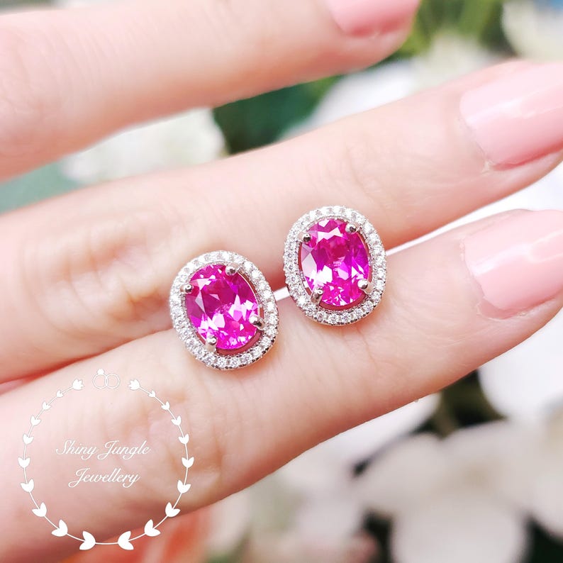 May include: A set of three ceramic mugs with a speckled, matte finish. Each mug features a different color: light blue, cream, and gray. The mugs have a simple, modern design with a rounded shape and a handle.