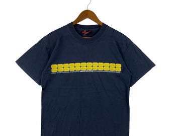 Maglietta da surf vintage QUIKSILVER Surfing degli anni '90 dal design semplice