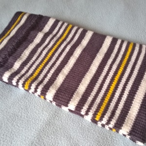 Handmade knitted baby blanket with slate gray-ecru-mustard stripes