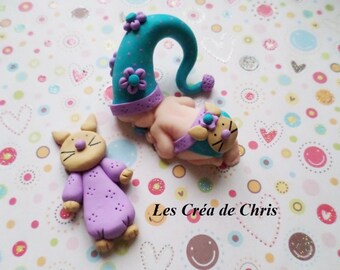 baby girl known cat polymer clay.