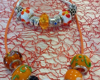 Orange charm girl bracelet and her necklace