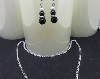 Black beads and rhinestones adornment