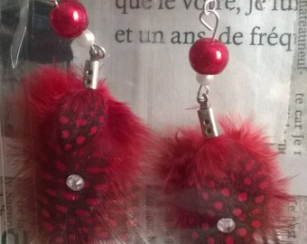 Feather and rhinestone earrings