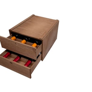 May include: A wooden wine rack with two drawers. The drawers are open and contain wine bottles. The top of the rack is closed.