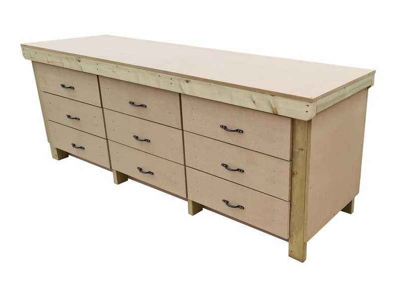 May include: A large wooden workbench with a light brown top and eight drawers. The drawers have black metal handles. The workbench is made of unfinished wood.