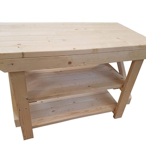 May include: A natural wood workbench with two shelves. The workbench is made of unfinished pine wood and has a rustic look.