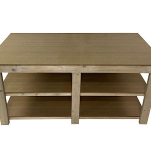 May include: A wooden workbench with two shelves. The workbench is made of natural wood and has a light brown finish. The top of the workbench is flat and smooth.