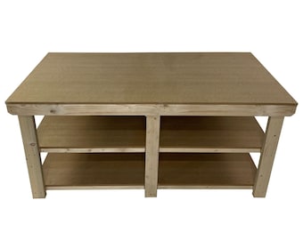 May include: A wooden workbench with two shelves. The workbench is made of natural wood and has a light brown finish. The top of the workbench is flat and smooth.