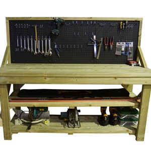 May include: A wooden workbench with a pegboard back, two shelves, and a variety of tools and equipment. The workbench is made of natural wood and has a rustic look.