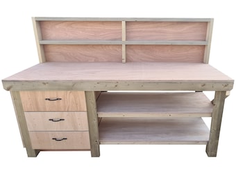 May include: A wooden workbench with three drawers and two shelves. The workbench has a backboard with a shelf.
