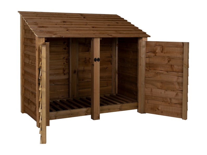May include: A wooden log storage shed with a slanted roof and two doors. The doors are open, revealing the interior of the shed, which has a slatted floor.
