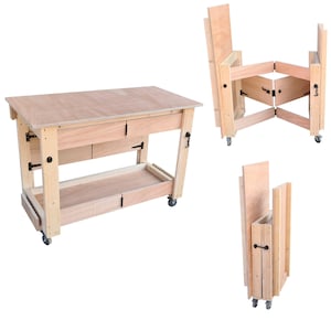 May include: A wooden workbench with a folding design. The workbench has a top surface, two drawers, a shelf, and four wheels. The workbench can be folded up for storage.