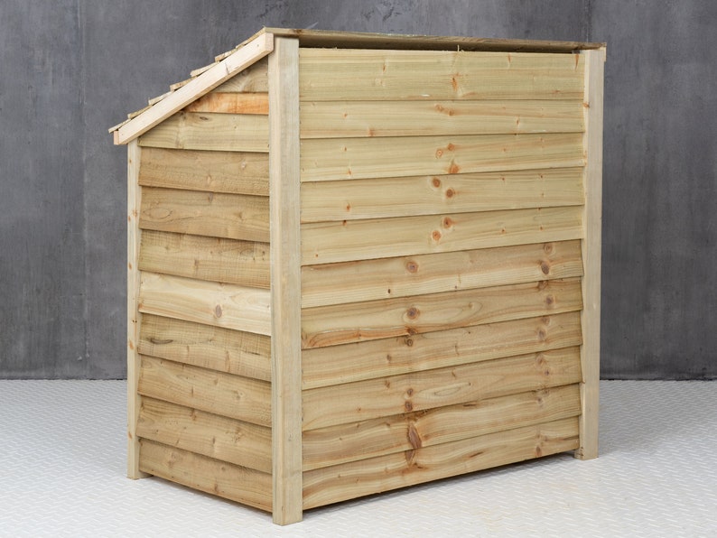 May include: A wooden storage shed with a slanted roof and a natural wood finish. The shed is made of horizontal planks and has a solid back.