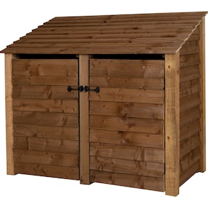 May include: A brown wooden double-door bin storage with a slanted roof. The bin storage has two doors with black metal latches.