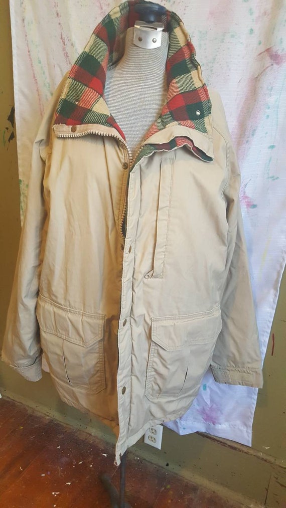 Vintage 1980s era women's insulated jacket. Tan, a