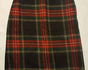 Vintage 1960s era plaid wool pencil skirt. Red/green /blue plaid, button zip closure, lined. Women's size XS/S. FREE SHIPPING