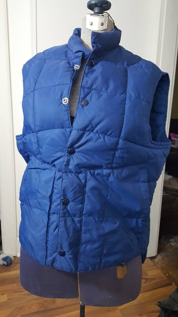 Vintage 1970s era mens blue down filled vest. Temp