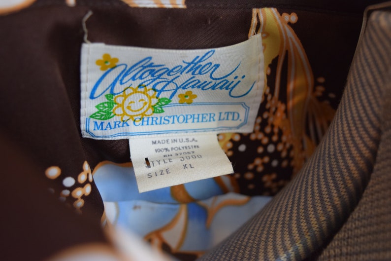 made in USA size XL Vintage 1960s Hawaiian polyester button-up brown with blue floral Altogether Hawaii Mark Christopher LTD
