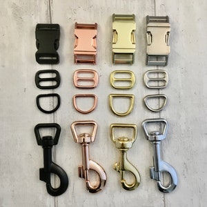 May include: An assortment of metal hardware components in black, rose gold, gold, and silver finishes. The image shows buckles, D-rings, and swivel snap hooks, suitable for crafting or pet-related items.