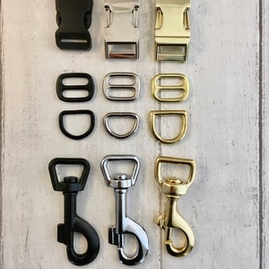 May include: Three sets of metal and plastic clasps and swivel hooks in black, silver, and gold. The clasps are for attaching leashes or collars to dog harnesses. The swivel hooks are for attaching leashes to collars.