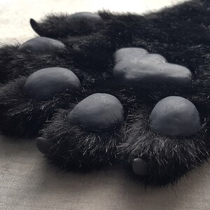 Pre-made black frusuit hand paws