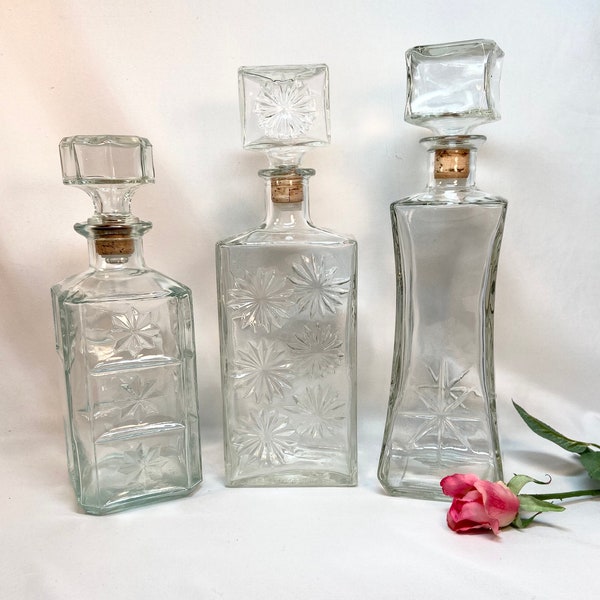 Vintage Liquor Whiskey Decanter Bottle Set Starburst Daisies Clear Mid Century - set of 3