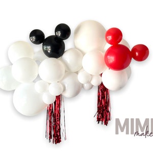 May include: A balloon garland with white, black, and red balloons. The balloons are arranged in a cloud shape with a black Mickey Mouse head and a red Mickey Mouse head at the top. There are red and black streamers hanging from the bottom of the garland. The text "MIMI maker" is visible in the bottom right corner of the image.