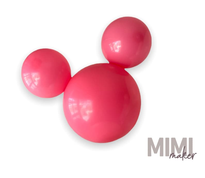 May include: Three bright pink spheres arranged in a Mickey Mouse-like shape. The spheres are smooth and glossy, with a slight reflection. The image is set against a clean white background. The text "MIMI maker" is in the bottom right corner.