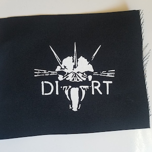 May include: White embroidered patch on black fabric with the word "DIRT" and a stylized skull with spikes.