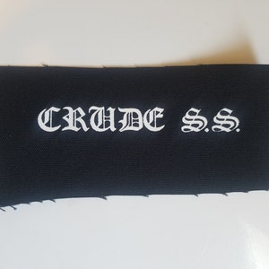 May include: Black fabric patch with white embroidered text that reads "CRUDE S.S."