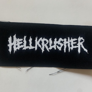 May include: Black fabric patch with white embroidered text that reads "HELLKRUSHER".