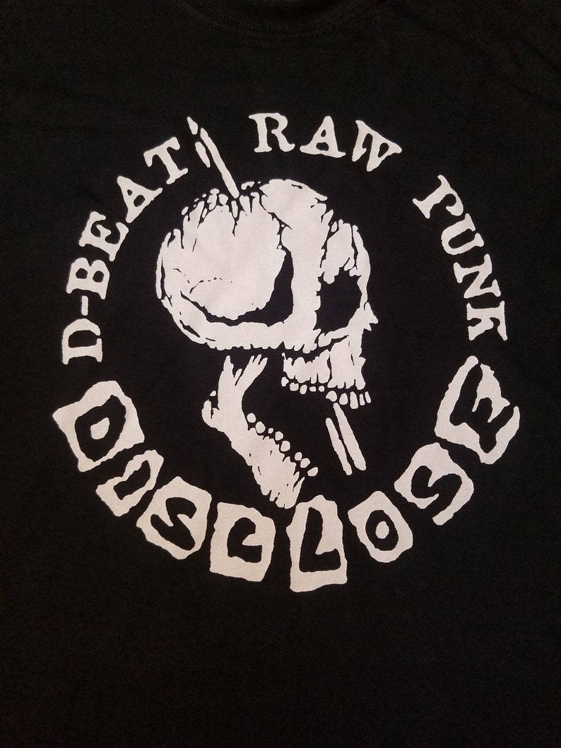 May include: Black t-shirt with a white circle graphic. The graphic features a skull with a needle going through its head. The text "D-BEAT RAW FUNK DISCLOSE" is written around the skull.