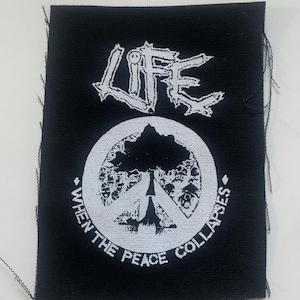 May include: Black and white embroidered patch with a peace sign and the text "When the peace collapses" and "LIFE" above the peace sign.