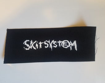Parche de tela con el logotipo de SkitSystem