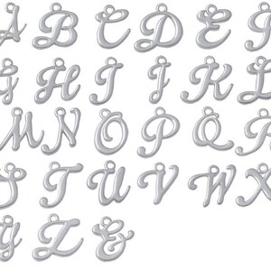 May include: A set of 26 silver-toned metal alphabet letter charms. Each letter is in a cursive script style. The charms are ideal for jewellery making, scrapbooking, and other craft projects.