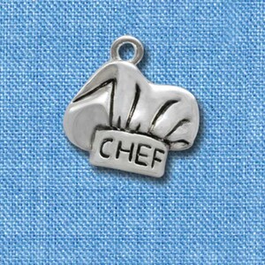 May include: Silver charm in the shape of a chef's hat with the word "CHEF" inscribed on the front.