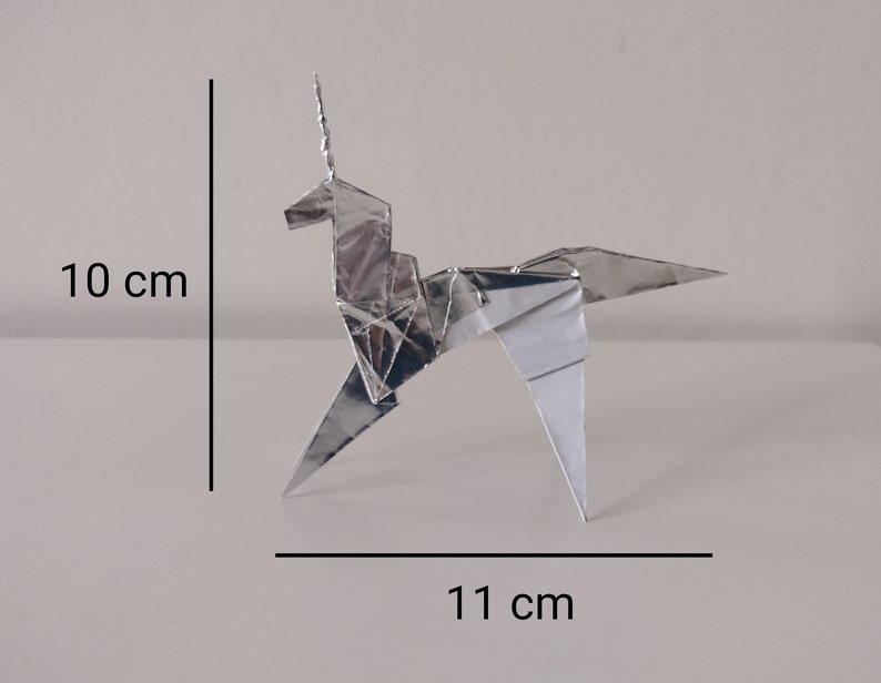 May include: A silver origami unicorn, 10 inches tall and 11 inches wide.