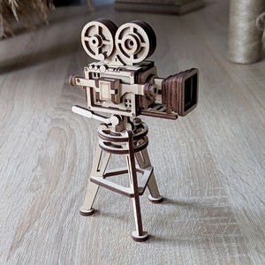 Arquivo vetorial para corte a laser de câmera de vídeo cinematográfica vintage, modelo SVG, para quebra-cabeça 3D em miniatura.