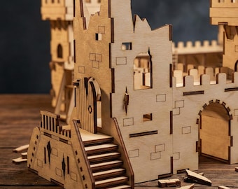 May include: A wooden model castle with a detailed design. The castle features towers, walls, a gate, and stairs. The model is made of light-colored wood and appears to be a DIY project or a decorative item. The castle is set on a wooden surface.