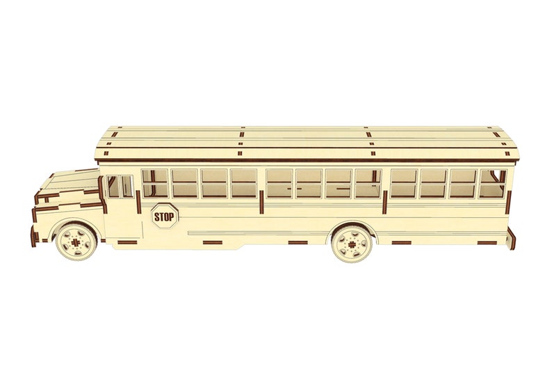 Puede incluir: Un modelo de madera de un autob&uacute;s escolar amarillo con una se&ntilde;al de "STOP" en el lateral. El autob&uacute;s tiene un techo marr&oacute;n y un ribete marr&oacute;n alrededor de las ventanas.
