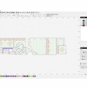 May include: A computer screen displaying a design program with a detailed, multi-layered design of a castle. The design is made up of various shapes and lines, with different colors representing different layers. The design is displayed on a grid, and the program's interface is visible along the top and right sides of the screen.