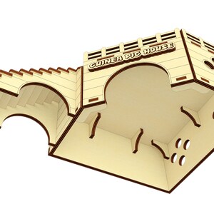 May include: A wooden guinea pig house with a ramp and a large arched opening. The house has a sign that reads "Guinea Pig House".