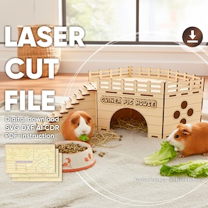 Laser cut wooden plywood Guinea Pig House with an arched entrance and side windows, featuring stairs leading to a fenced rooftop platform. The light wood structure is displayed on a fluffy white rug with hay, a food bowl, and two live guinea pigs eating lettuce, clearly showing the scale and function as a pet hideaway