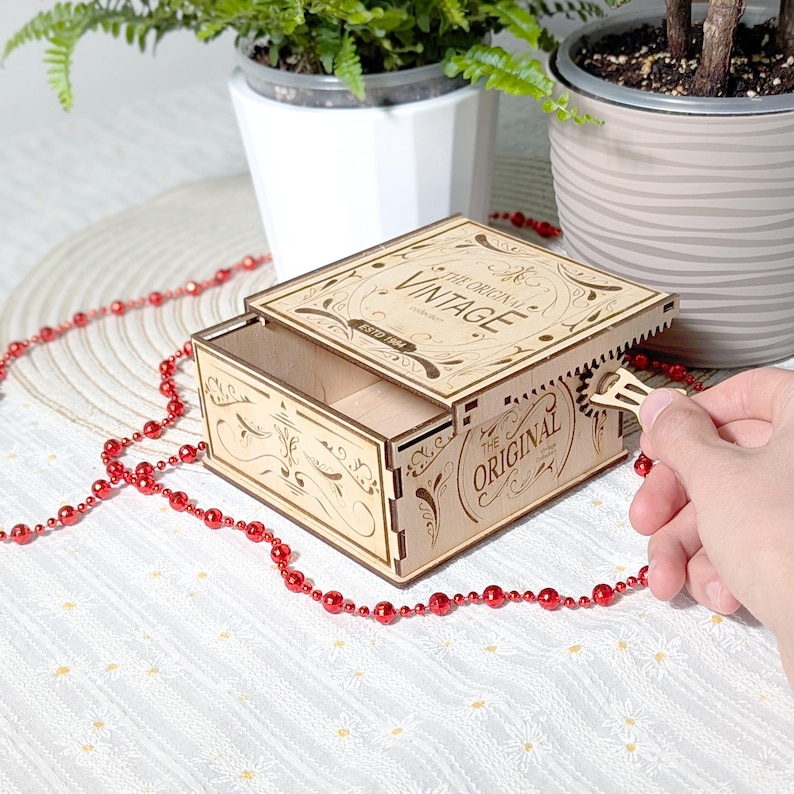 Steampunk laser cut box with moving gear mechanism