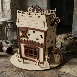 Three-quarter view of a zombie-themed house made from laser cut plywood.