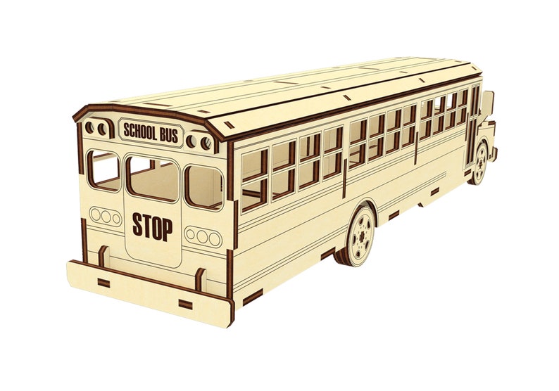 Puede incluir: Un modelo de madera de un autob&uacute;s escolar amarillo con ribetes marrones. El autob&uacute;s tiene las palabras "SCHOOL BUS" y "STOP" impresas en el lateral. El autob&uacute;s tiene ventanas y ruedas.