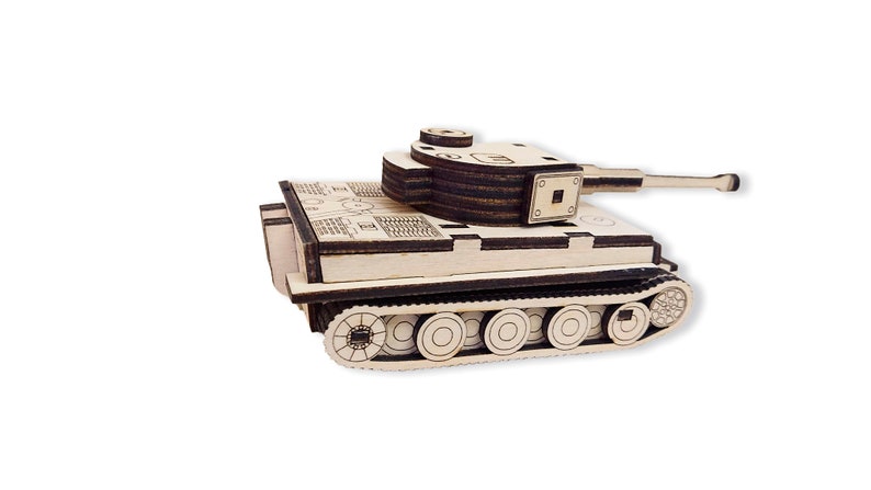 May include: A wooden model of a German Tiger tank. The tank is made of multiple layers of wood and has a detailed design. The tank is painted in a light brown color and has a black gun barrel.