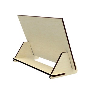 May include: A wooden easel stand with a light brown finish. The easel is designed to hold a picture or a small sign.